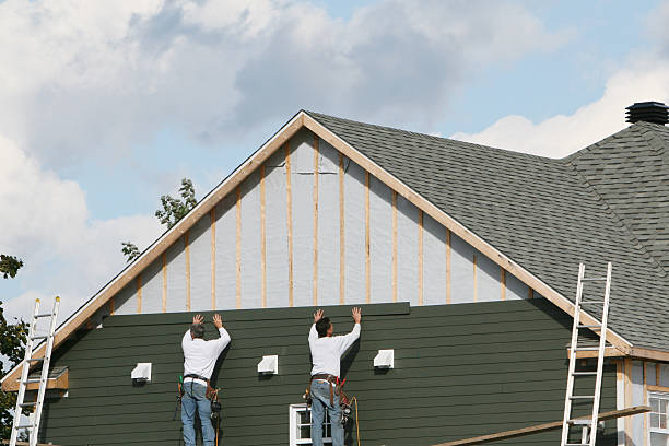 Professional Emergency Siding Repair technician working in Reinholds, PA